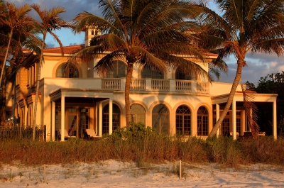 beautiful summer beach house with the sun shining on it