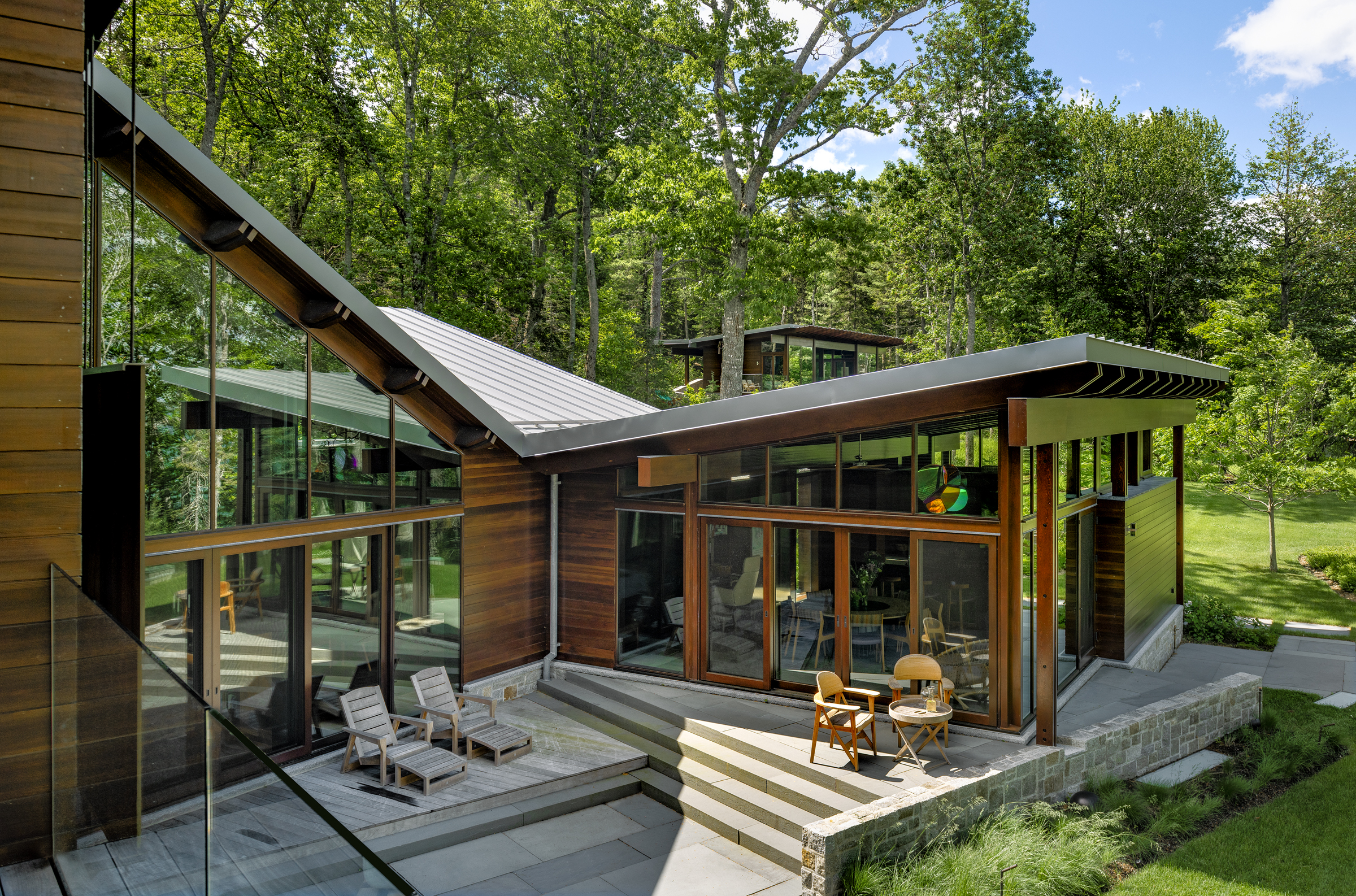 SPAN Architecture's modern August Moon residence nestled into the forest in Bar Harbor, Maine