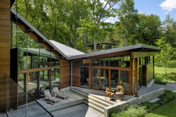 Cedar and glass pavilions step through the forest at August Moon in Bar Harbor