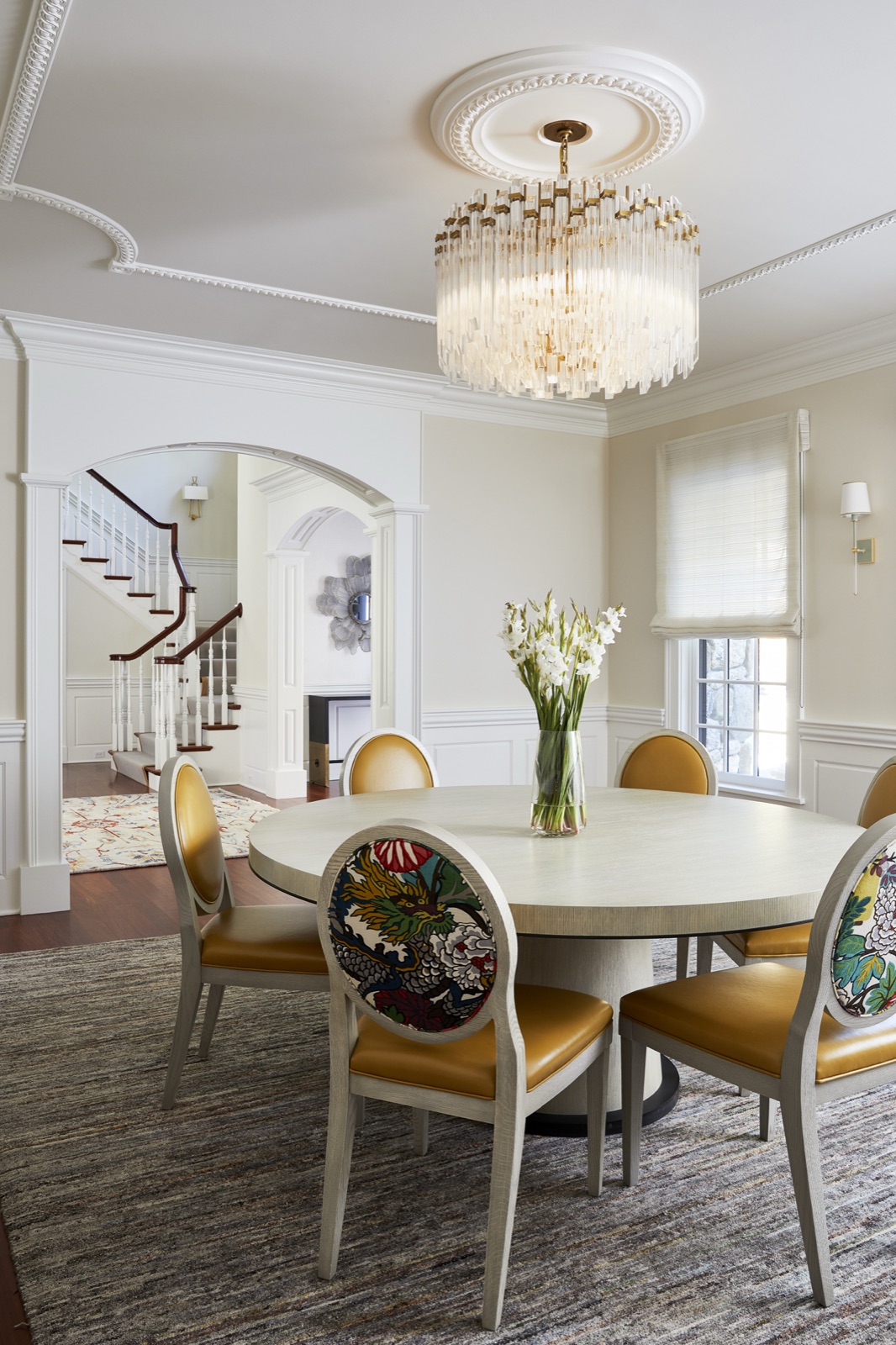 Dining room at King’s Way set for a meal beneath a chandelier