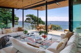 Miter Point living room opening onto a covered deck and views of Wellfleet Harbor