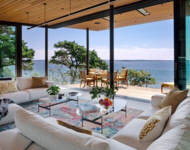 Miter Point living room opening onto a covered deck and views of Wellfleet Harbor