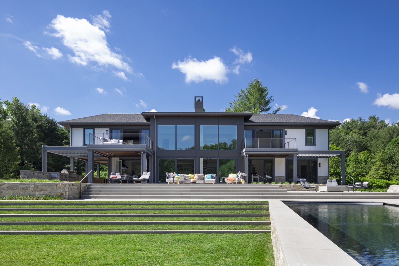 Rear exterior of Terrace Edge with terraces stepping down toward the lawn